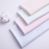 Plain Cloth Materials Soft Stock Yarn Dyed 100% Cotton Interlock Knit Fabric for Baby Suit